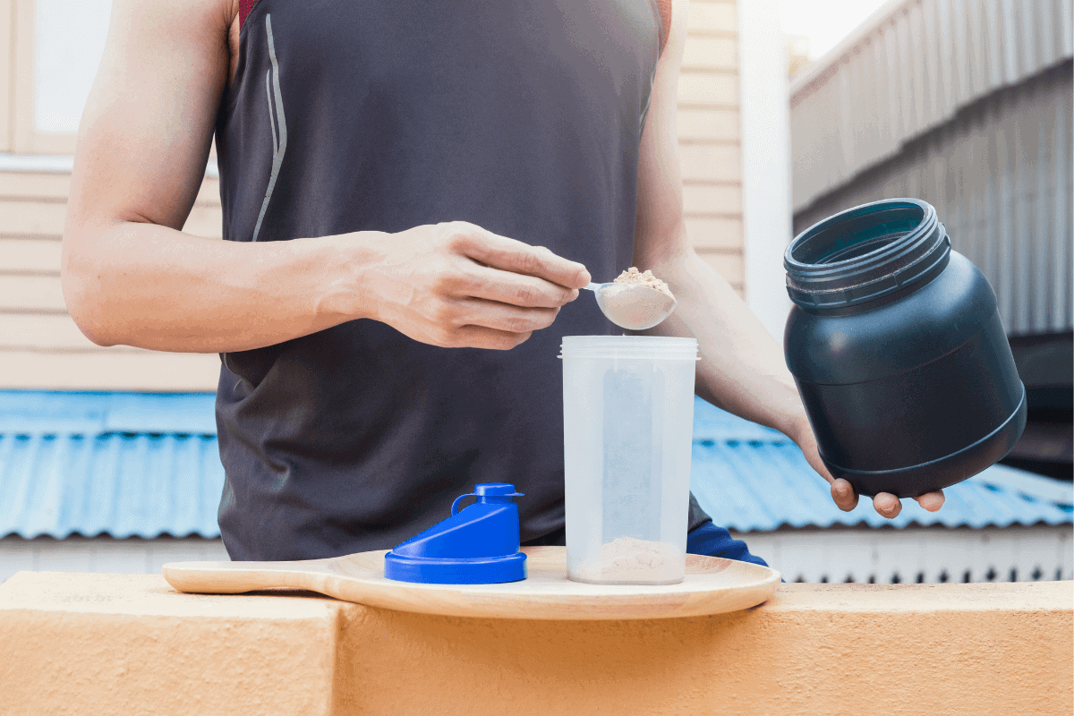 Man making protein shake.